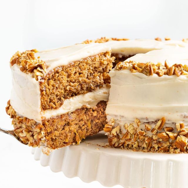 Hummingbird cake layered with banana, pineapple and pecans under cream cheese frosting