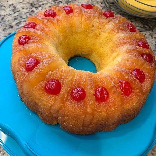 Pineapple upside-down cake with caramelized pineapple rings and maraschino cherries